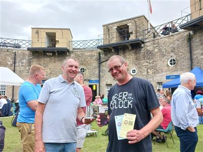 Presenting a tankard to Ian, winner of the passport prize draw at the 2022 Harwich & Dovercourt Bay Winter Ale Festival, at the Wharf Brewery festival at the Harwich Redoubt, 28/07/2023.