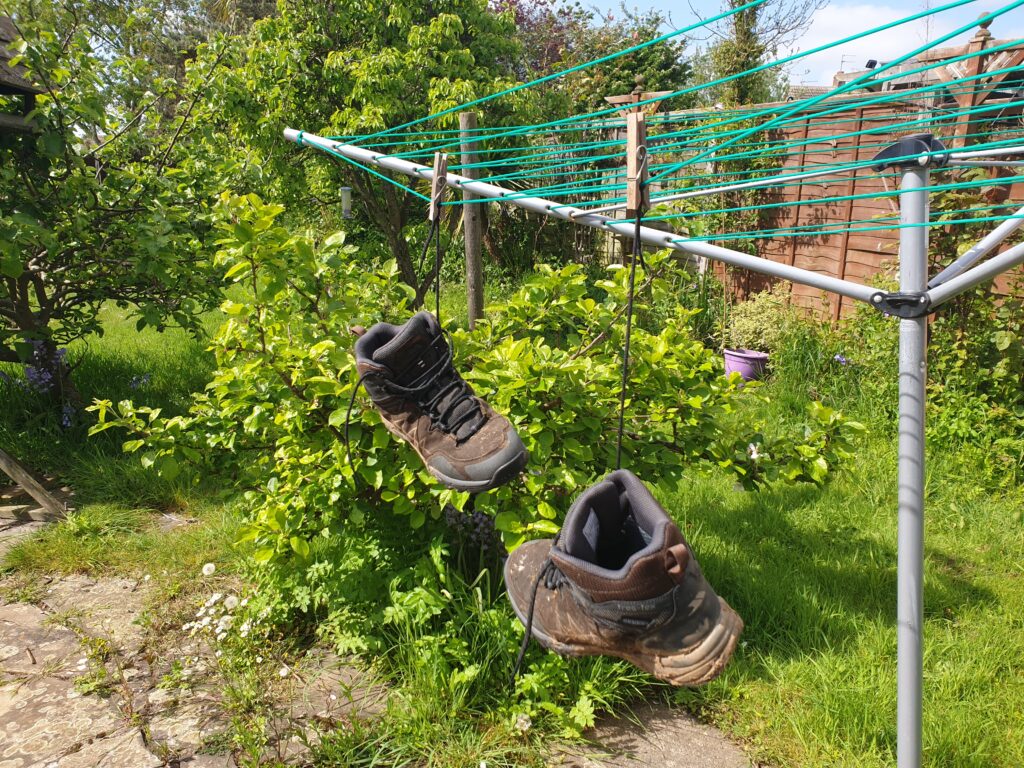 Boots hanging on a washing line to dry after RambAle 18 in May 2022