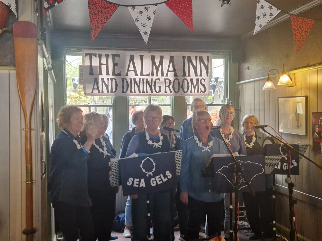 The Sea Gels singing in the Alma Inn at the 2025 Harwich Shanty Festival